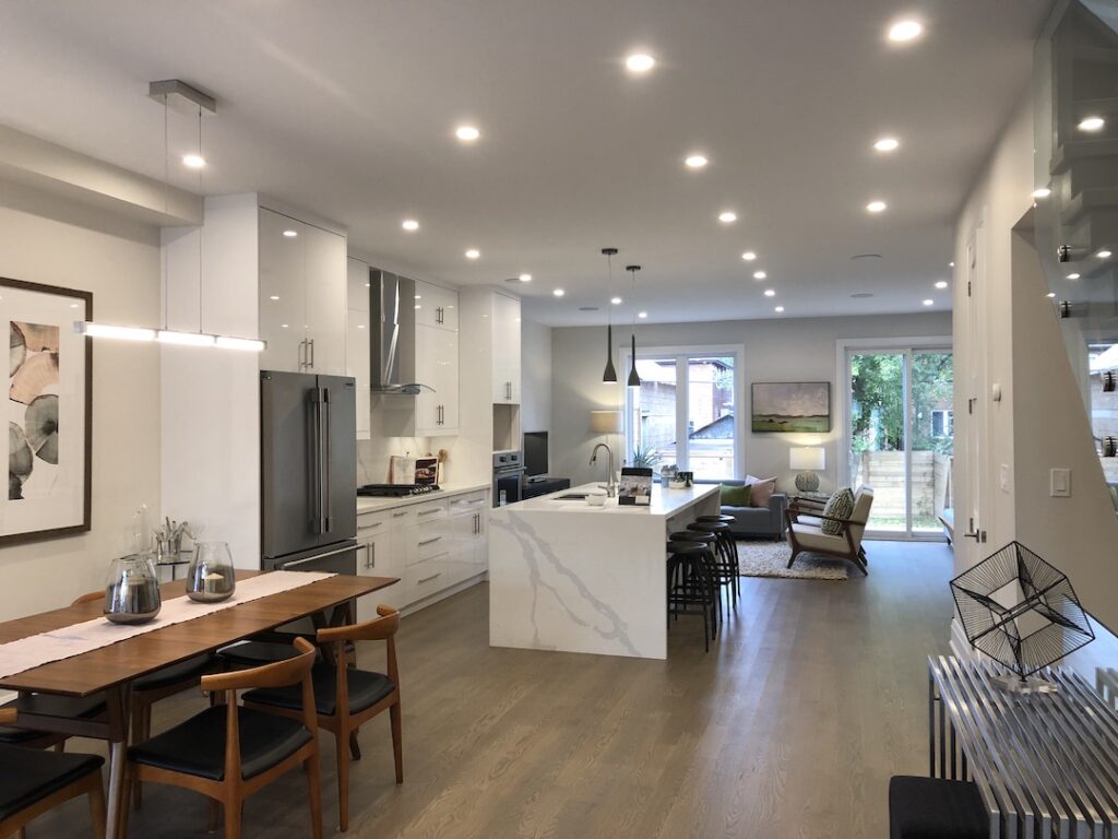 Open-plan kitchen and living area with recessed ceiling lights