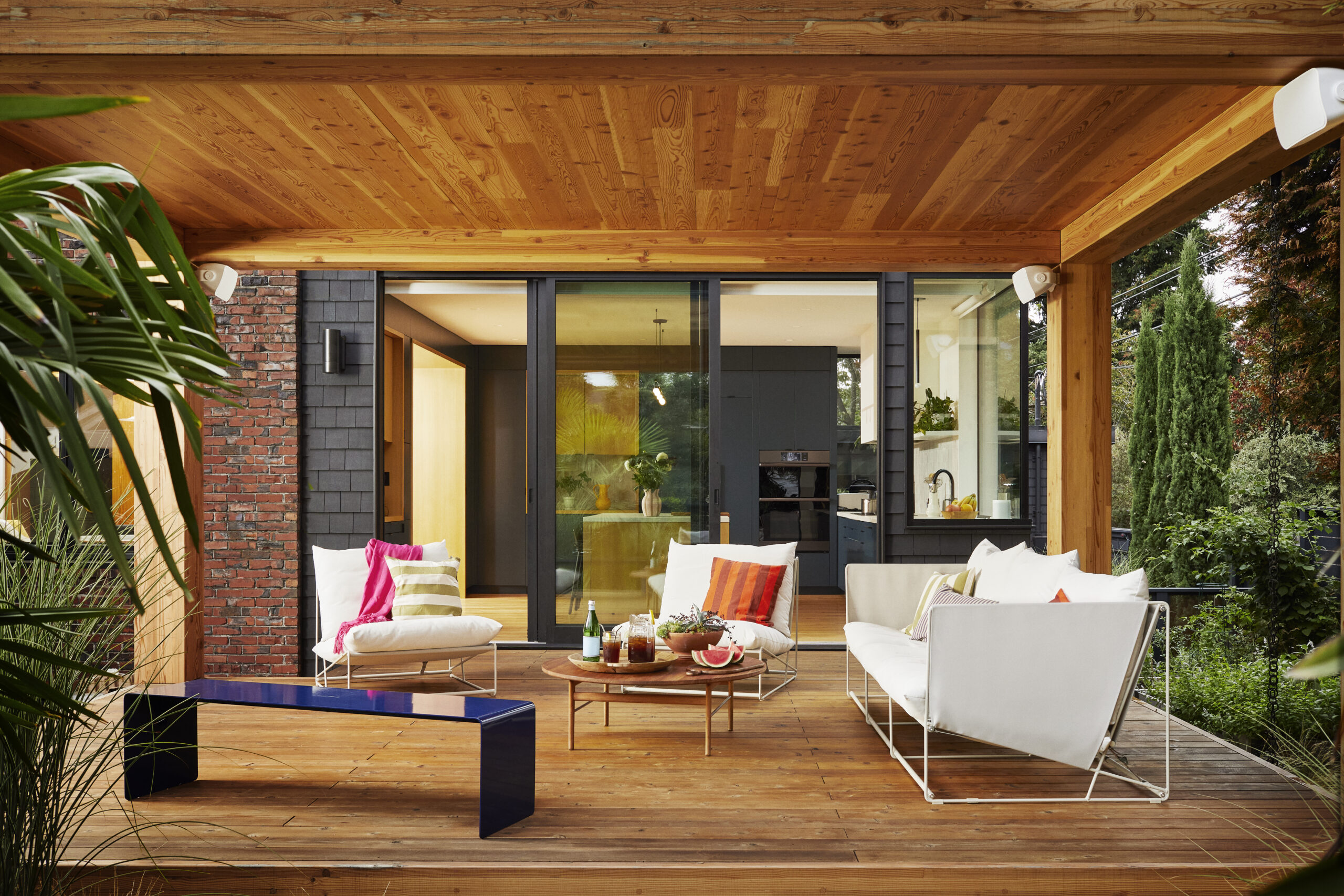 Sonos speakers on a landscaped outdoor patio