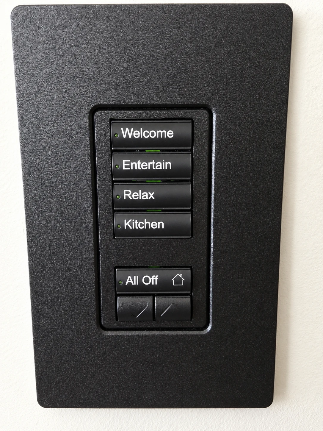 Black scene keypad with labelled buttons for Welcome, Entertain, Relax, Kitchen and All Off