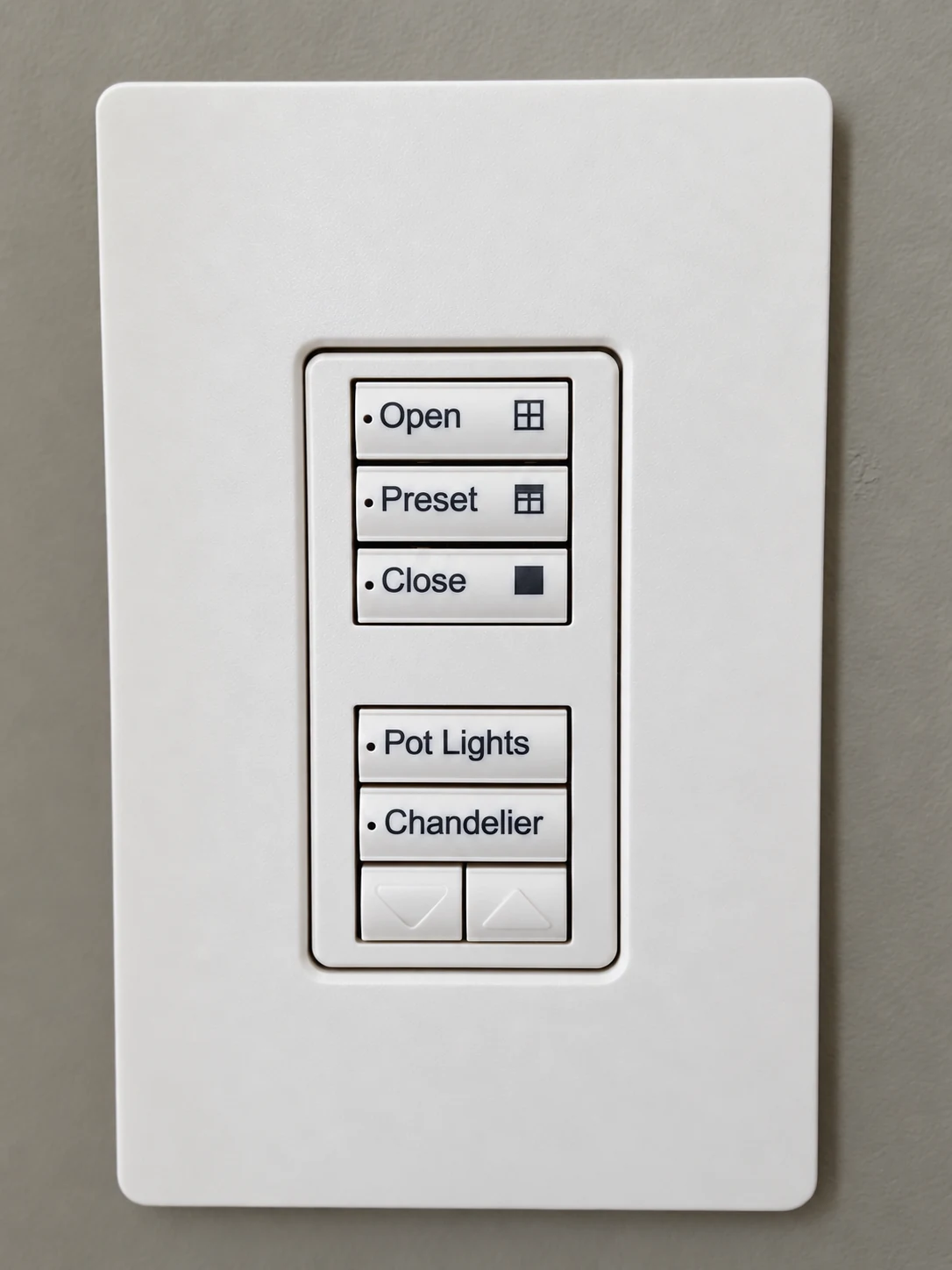 White keypad with shade controls and labelled pot light and chandelier buttons